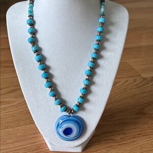 Chic Blue Beaded Necklace with Swirl Pendant
